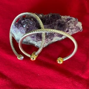 2 cable silver tone bangles. No brand